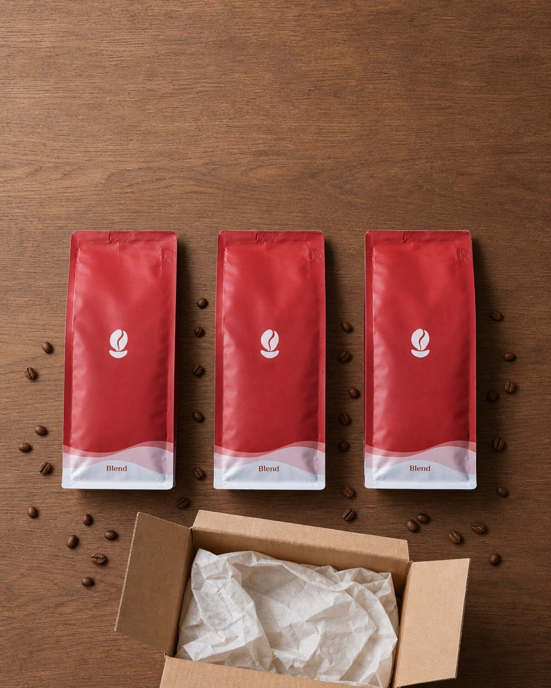 Three Bean Shipper blend bags beside an open shipping box